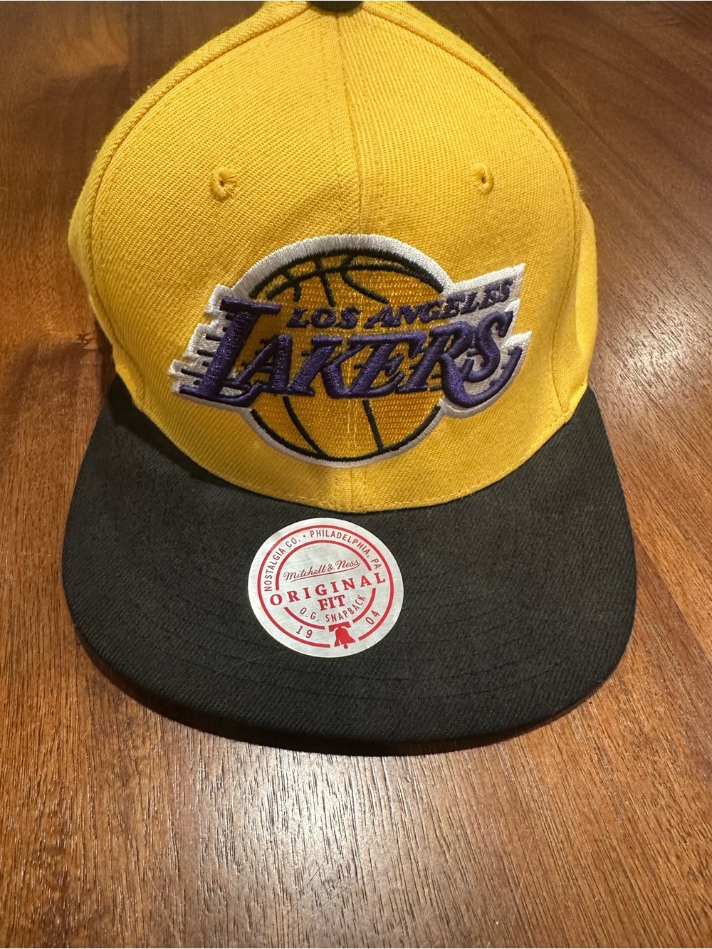 Nostalgia Black and Gold Snapback Hat with Silver Sticker